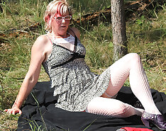 Squirting mature slut masturbating in the woods