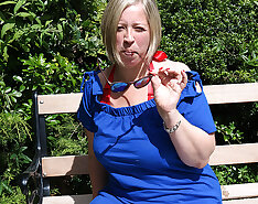 Naughty mature lady playing with herpussy in the garden