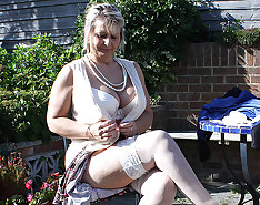 Big breasted mature slut playing in the garden